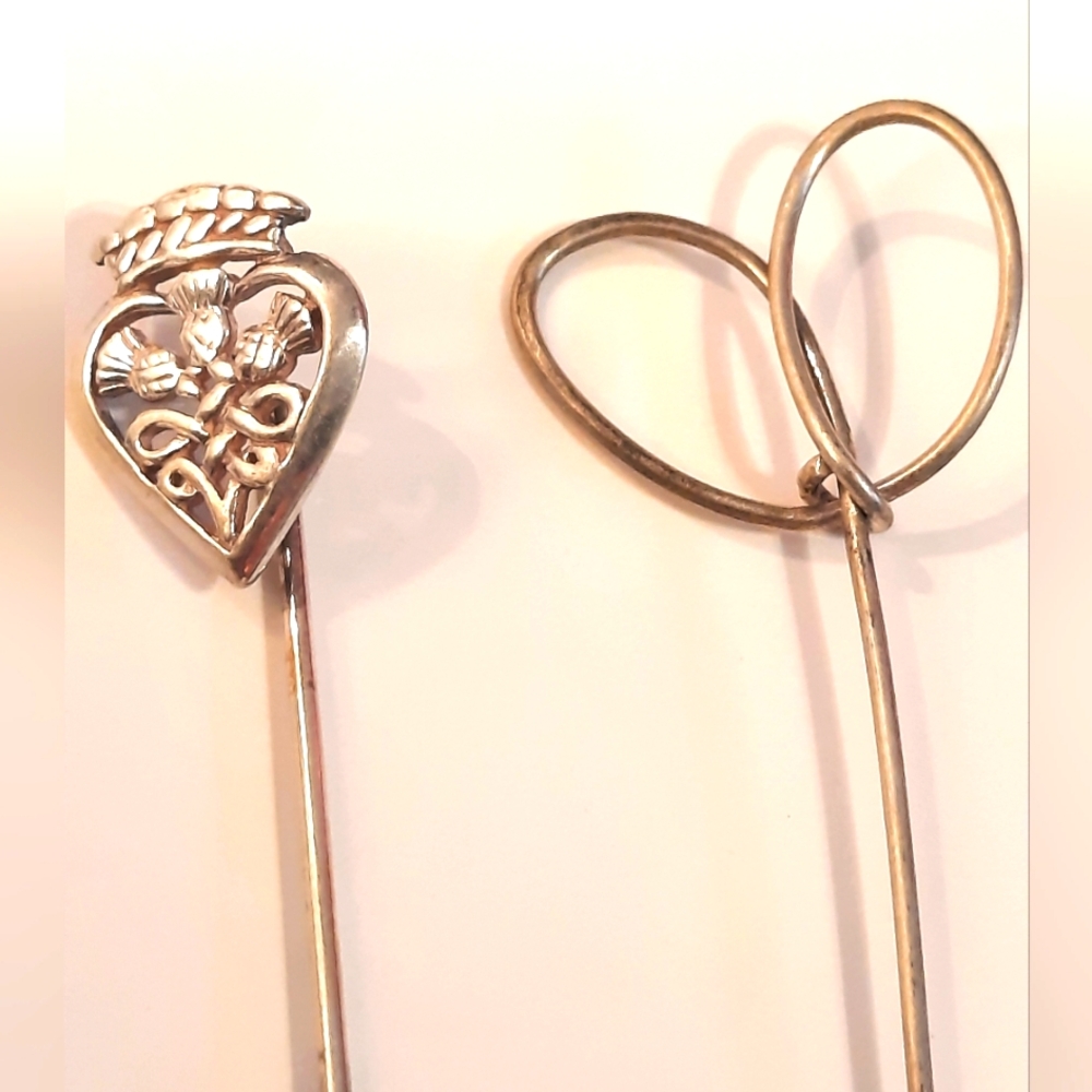 2 Sterling Silver Pins.